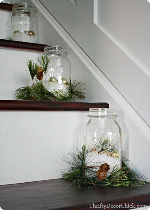 Staircase Decorated With Ball jars Filled with Fake Snow and Ornaments